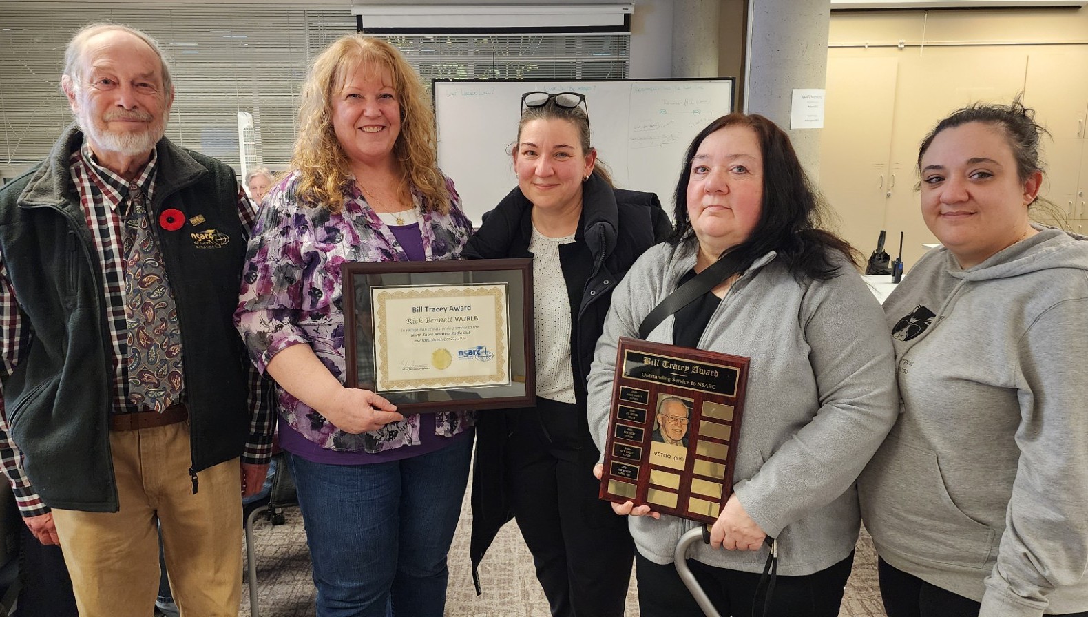 Allan VE7BRD and Janice VA7JMO present the award to Rick Bennett's VA7RLB(SK) family: Josie VA7JOP, Roselle VA7RXR and Rose-Mary VA7ROZ